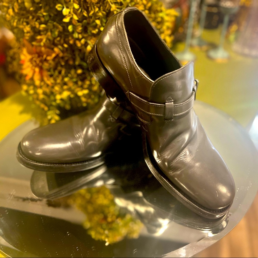 Gray, leather loafers with buckle.